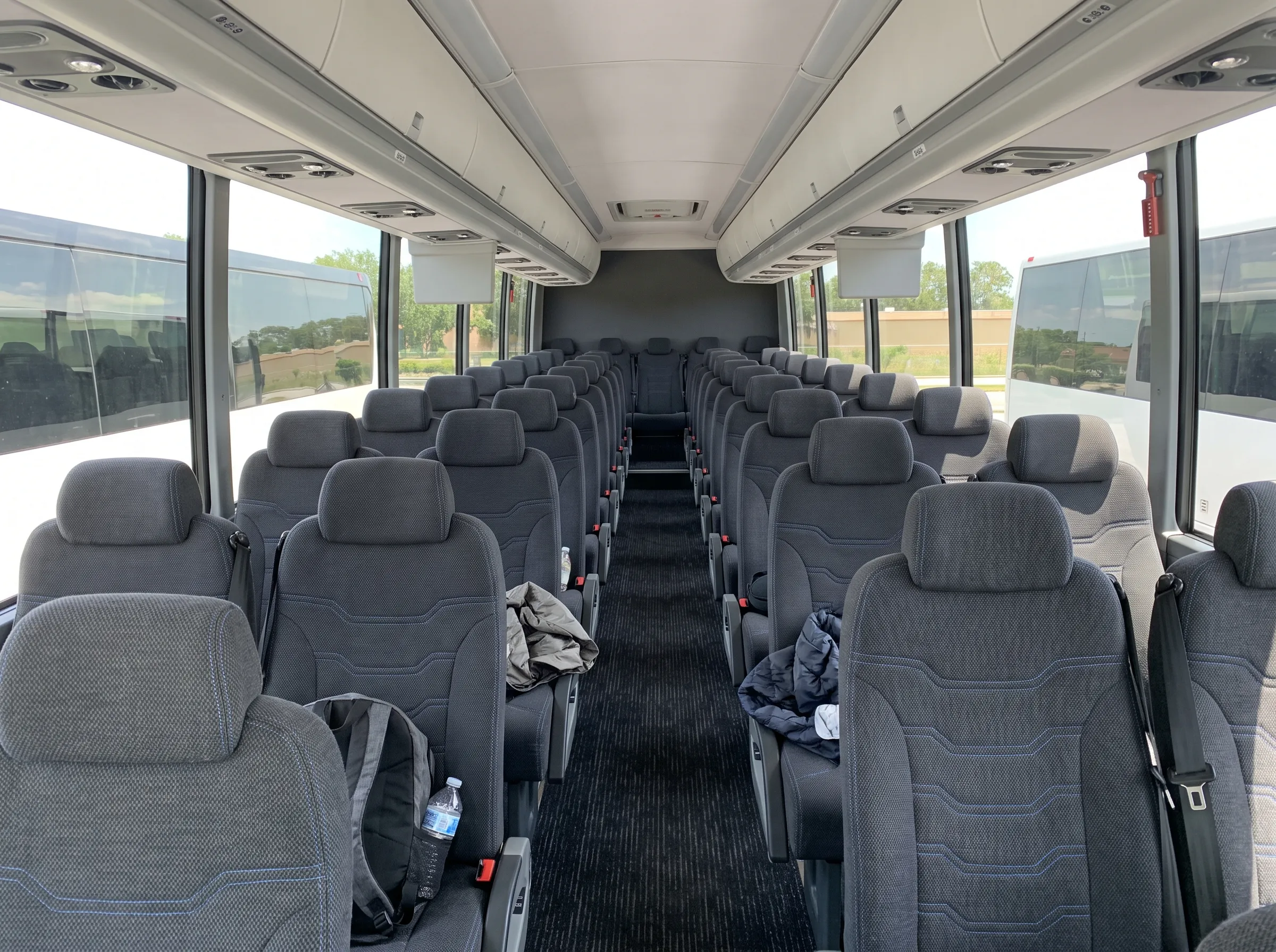Interior of a Causeway Coach motorcoach with reclining seats and overhead storage