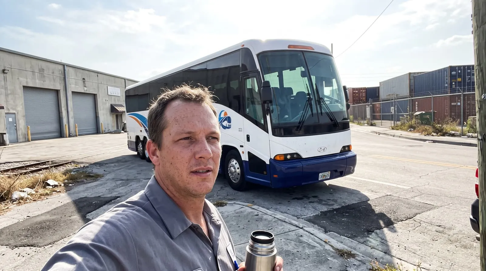A worker boarding a Causeway Coach shuttle on an industrial road in the Medley corridor near Hialeah