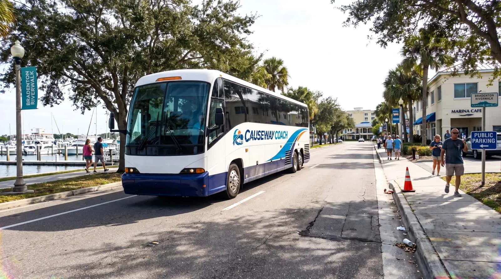 Causeway Coach motorcoach loading a sports team and equipment at a Bradenton athletic campus