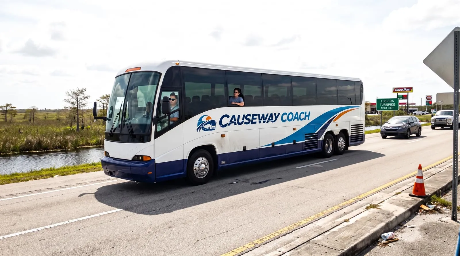 Causeway Coach motorcoach crossing Alligator Alley from Fort Myers toward the Miami cruise ports